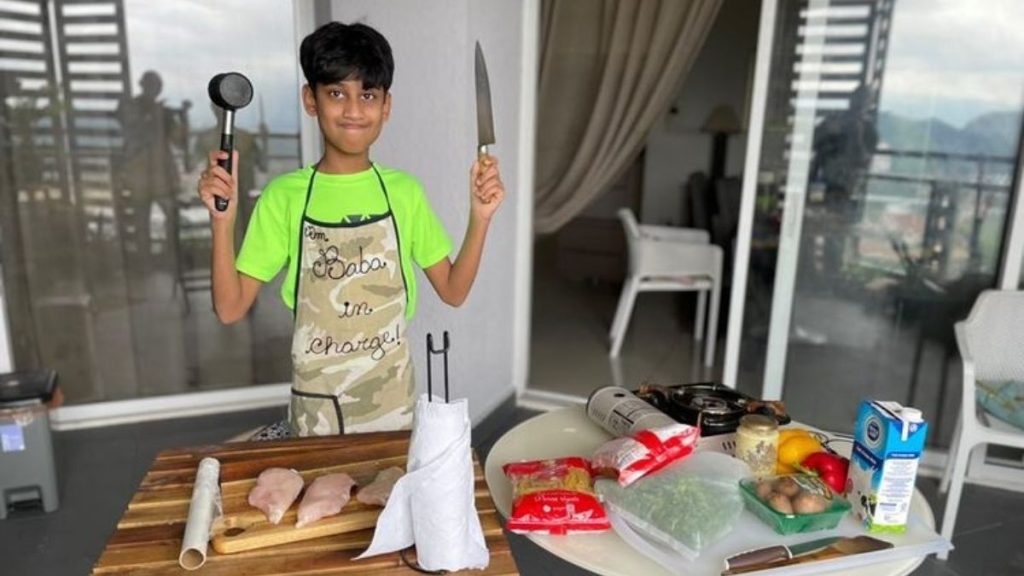 boy learning how to cook