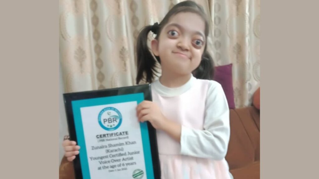 voiceover artist holding her certificate