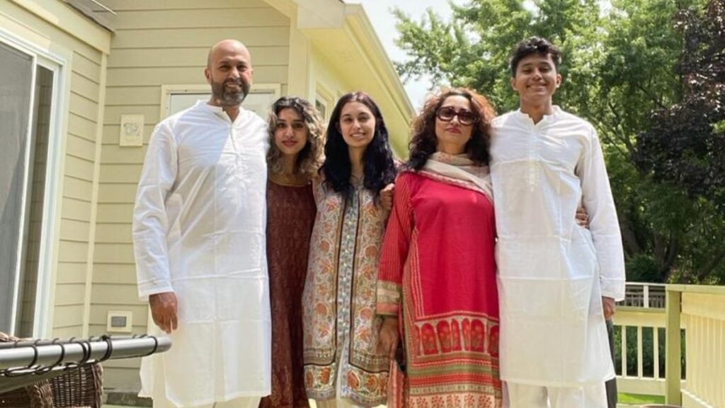 immigrant family in traditional outfits